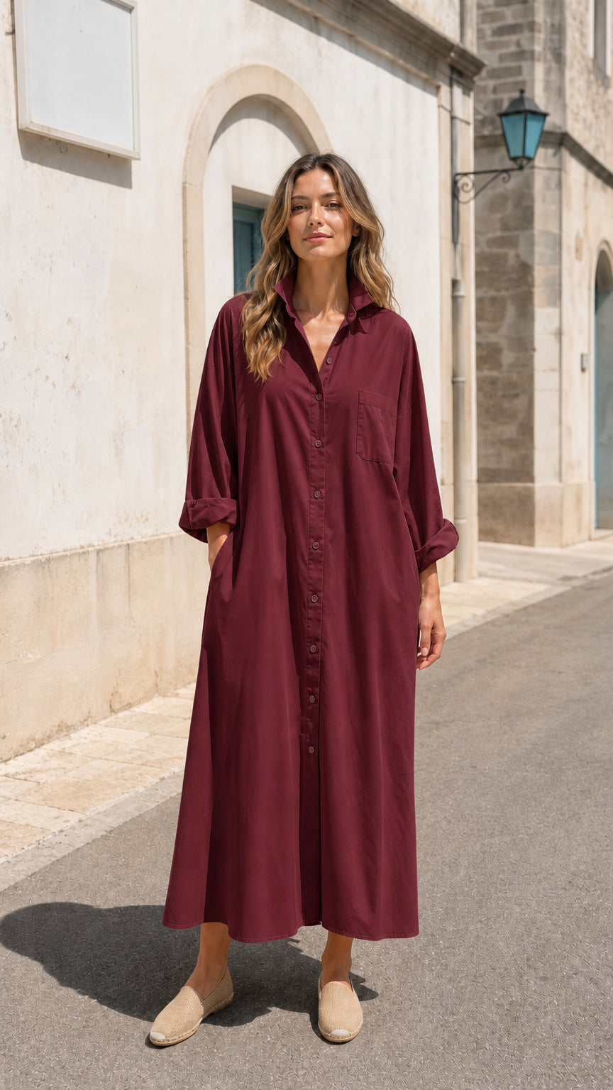Front view of woman wearing burgundy long sleeve button-down maxi shirt dress