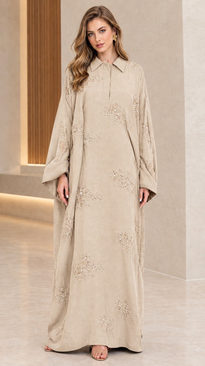 Front full-length view of woman wearing beige champagne collared sequin embellished abaya maxi dress