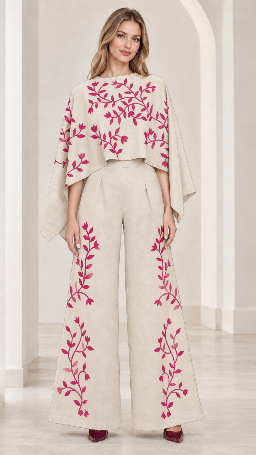 Front view of champagne off-white embroidered cape sleeve wide leg jumpsuit