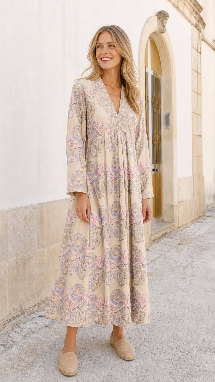 Model wearing beige floral maxi dress