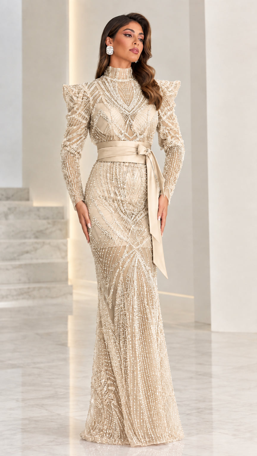 Model wearing champagne gold beaded evening gown with satin belt
