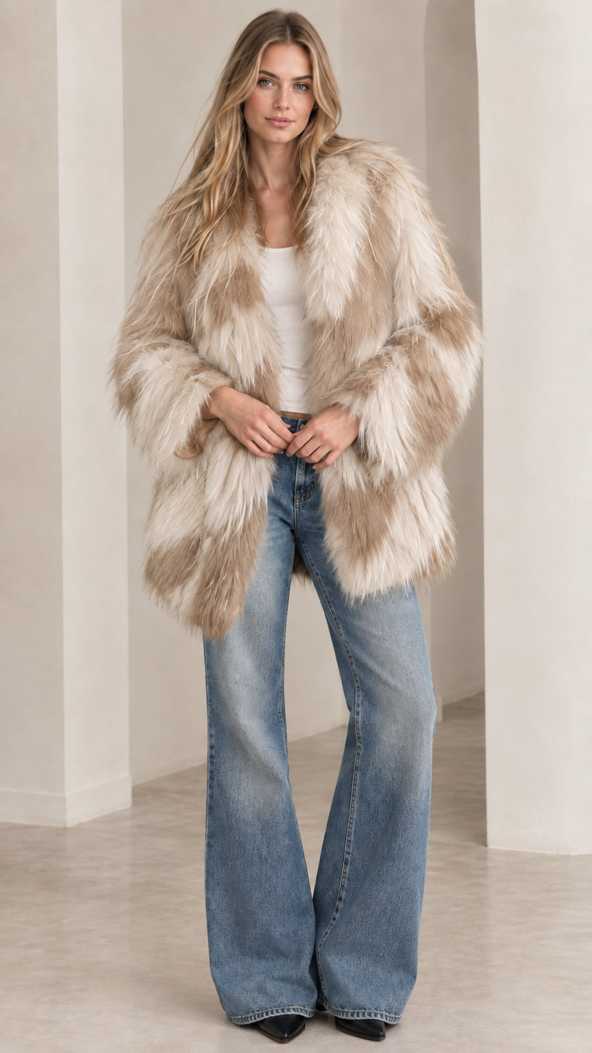 Model wearing beige and cream chevron shaggy faux fur coat