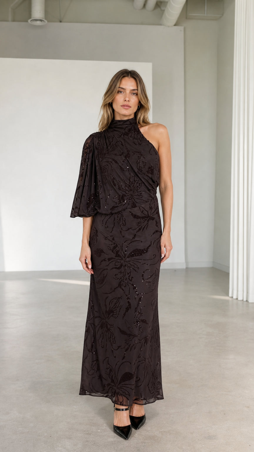 Front view of model wearing espresso brown one-shoulder high neck embellished maxi dress