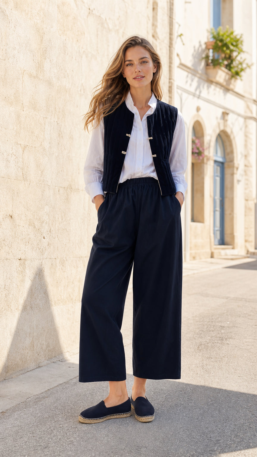 Woman wearing Navy quilted vest and wide-leg pants co-ord set, front view