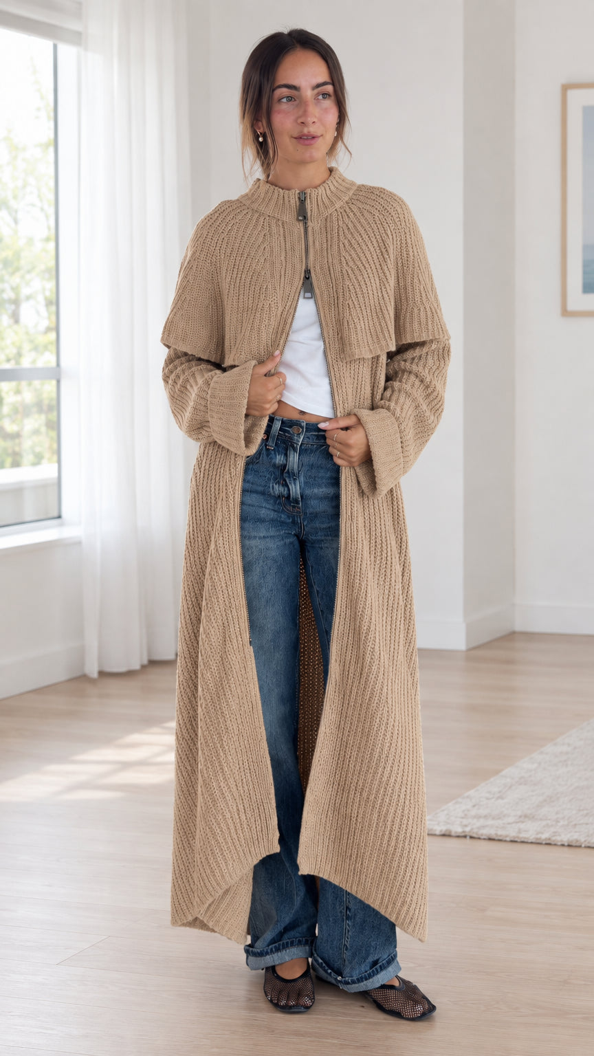 Front full view of woman wearing camel ribbed knit maxi cardigan coat with capelet