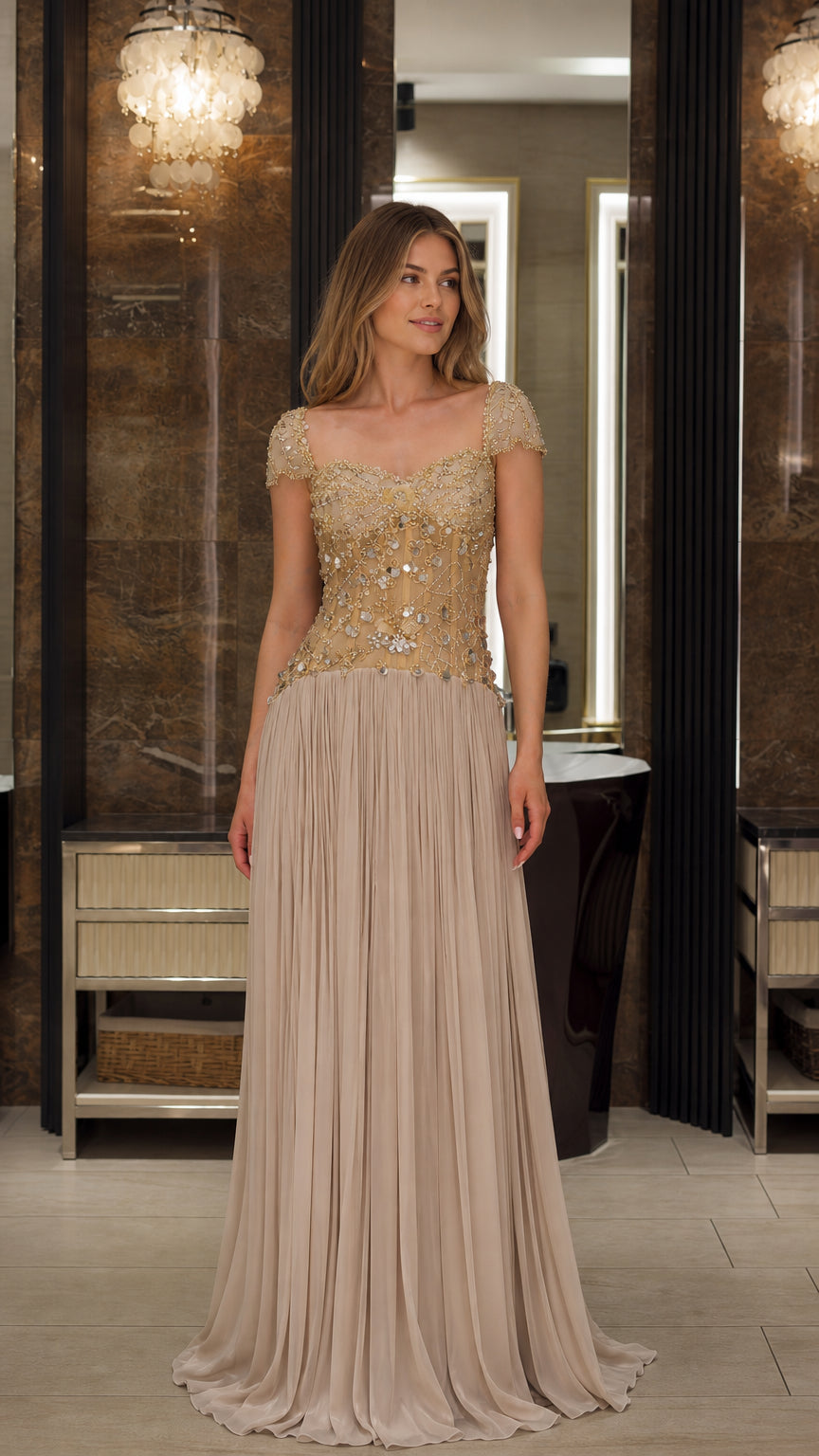 Full front view of model wearing the Champagne beaded cap sleeve pleated chiffon evening gown