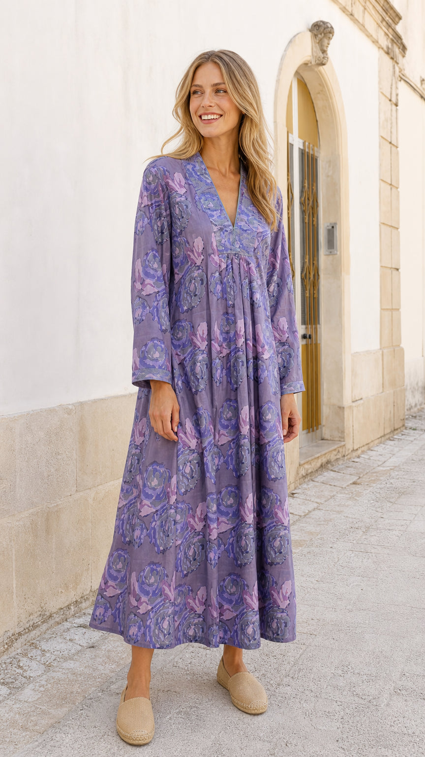 Front view of model wearing purple floral maxi dress