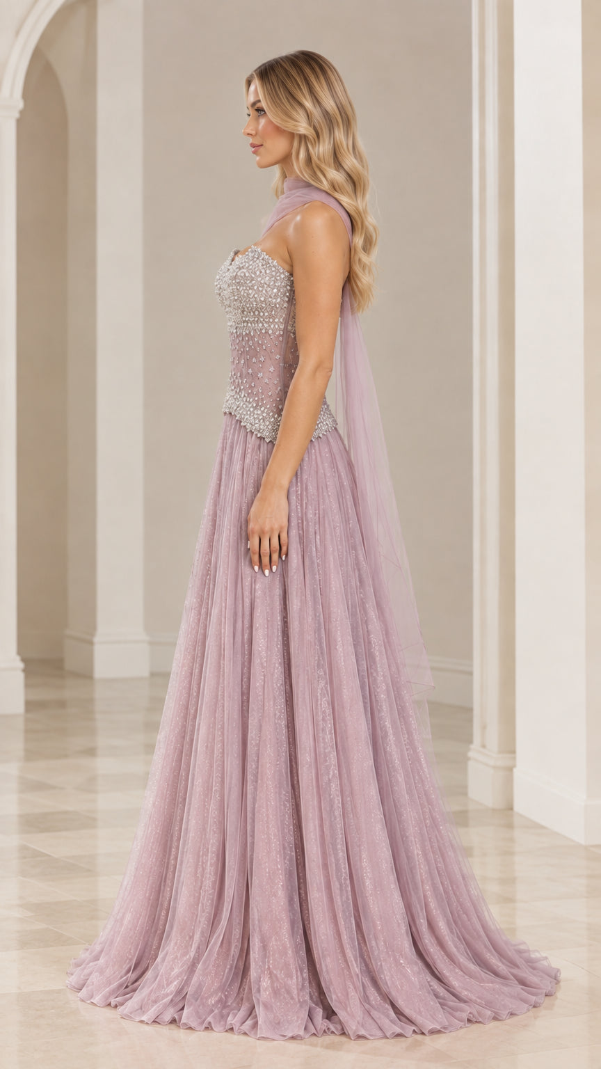 Side profile view of dusty mauve formal tulle dress showing basque waist and flowing skirt