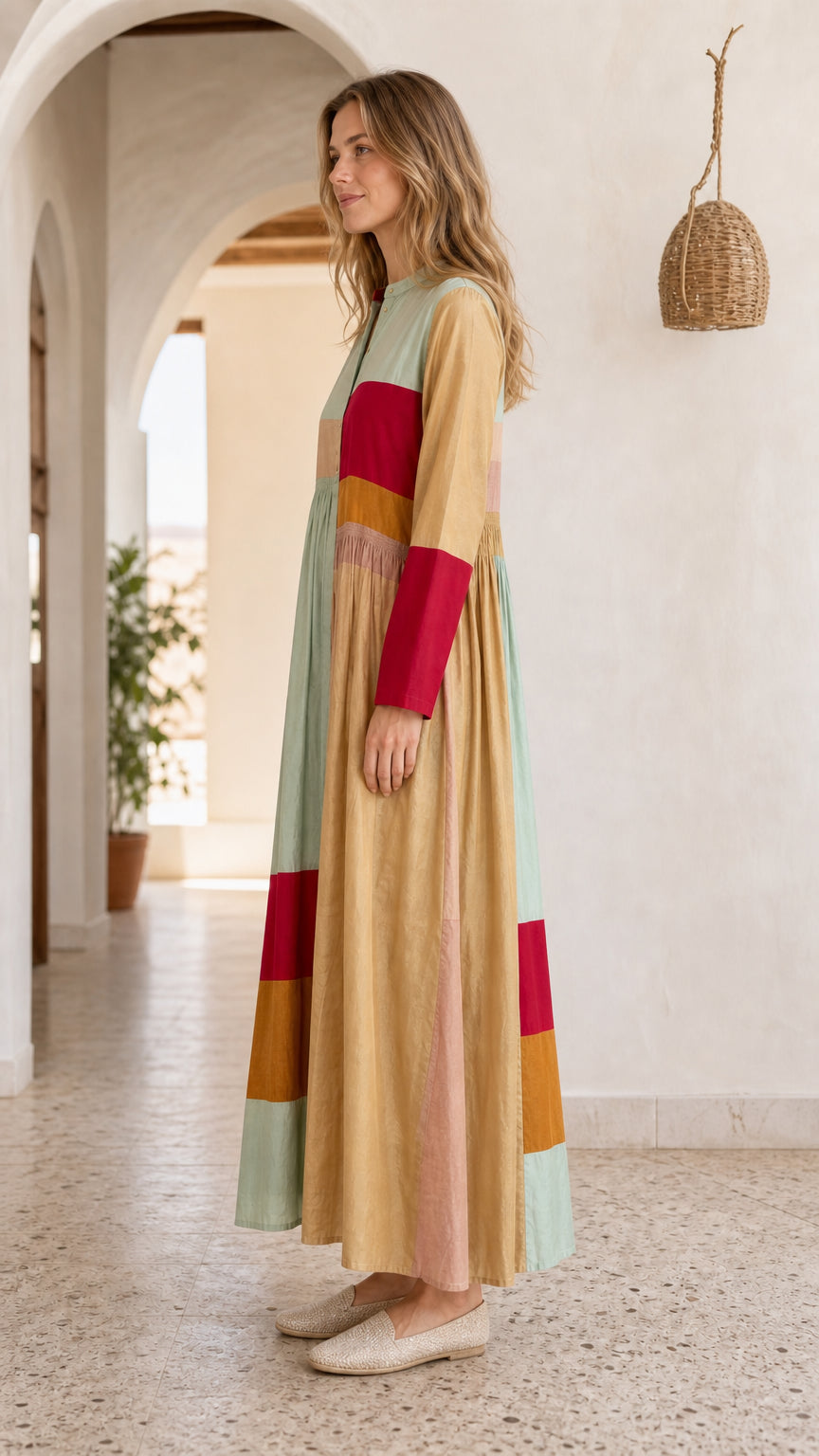 Side profile view of model in the multi-color colorblock maxi dress
