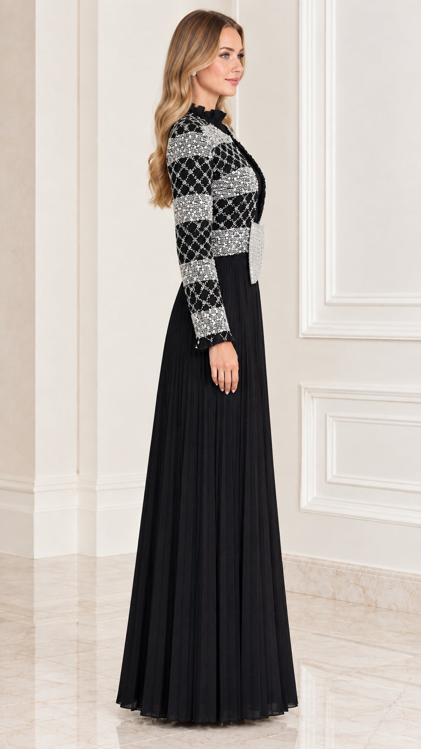 Side profile of black long sleeve pleated formal gown