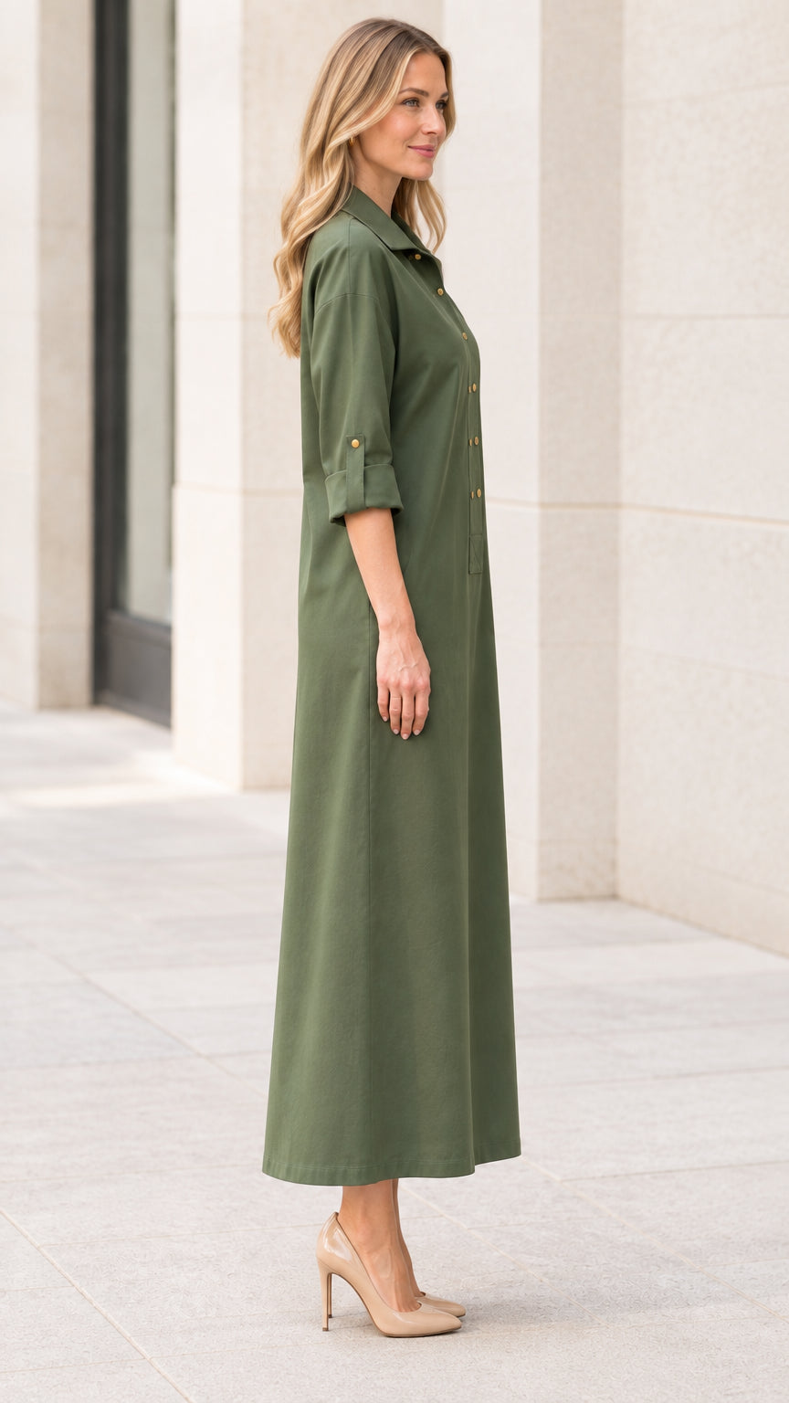 Side profile view of women's olive green long shirt dress