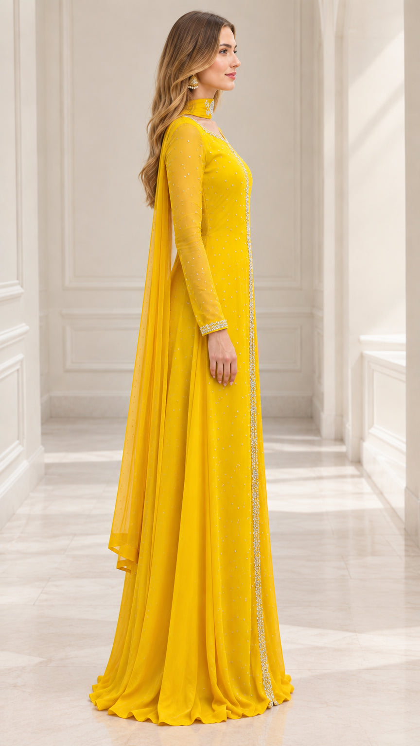 Side profile of yellow long sleeve formal gown showing flowing cape silhouette
