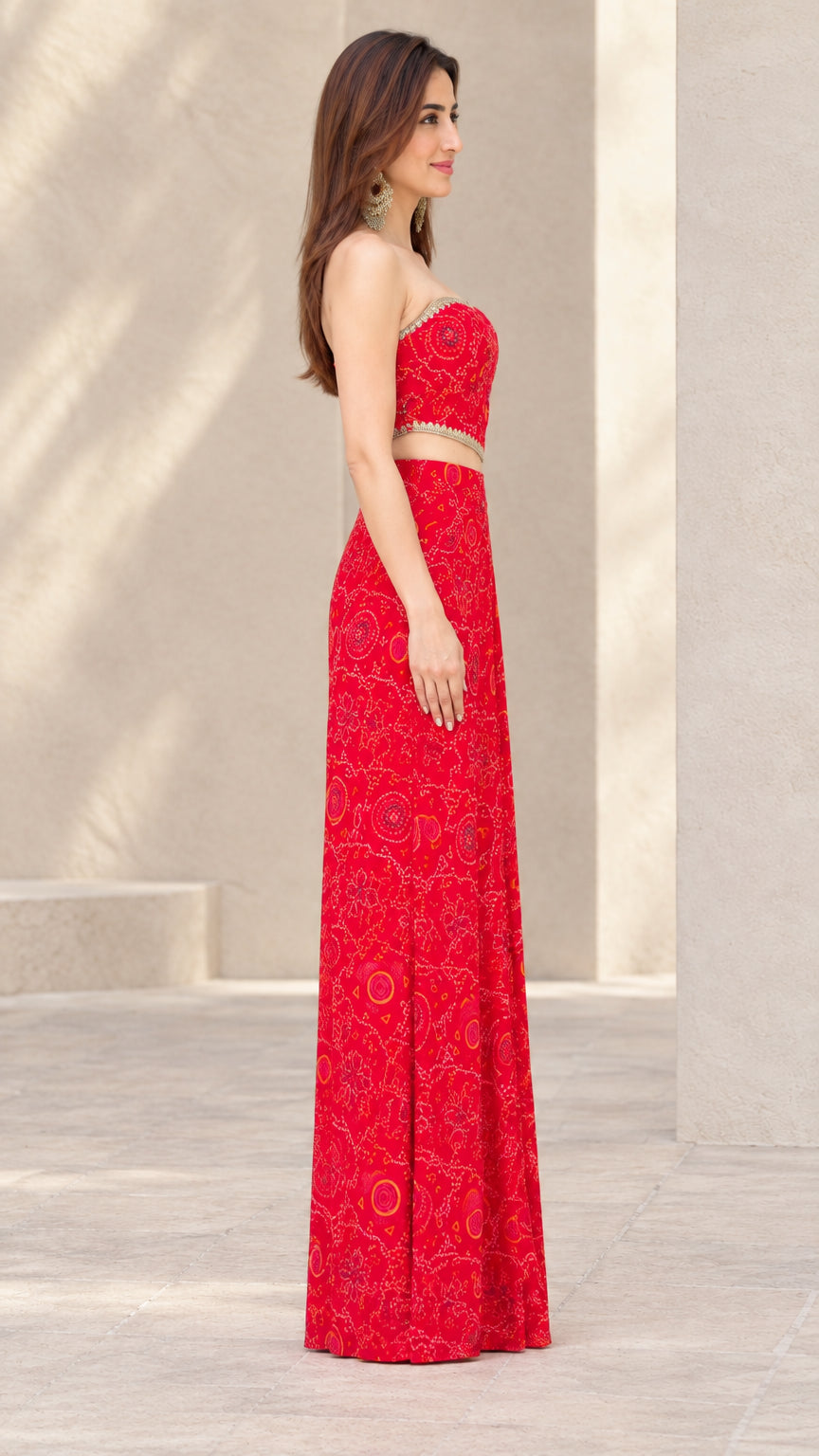 Side profile of woman in Red printed two-piece draped skirt set