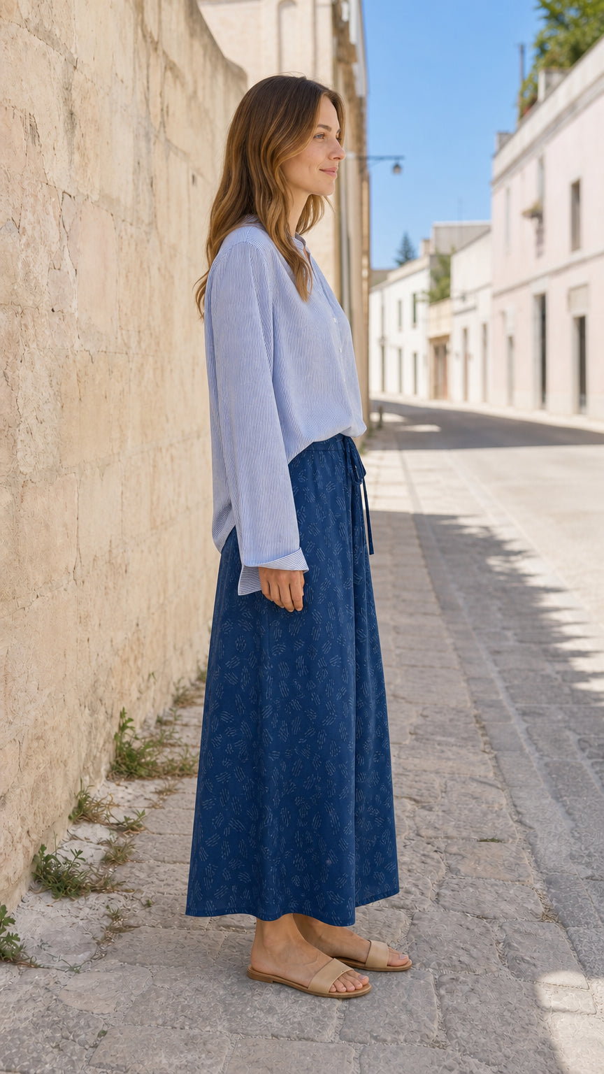 Side view of woman in blue two-piece set outdoors