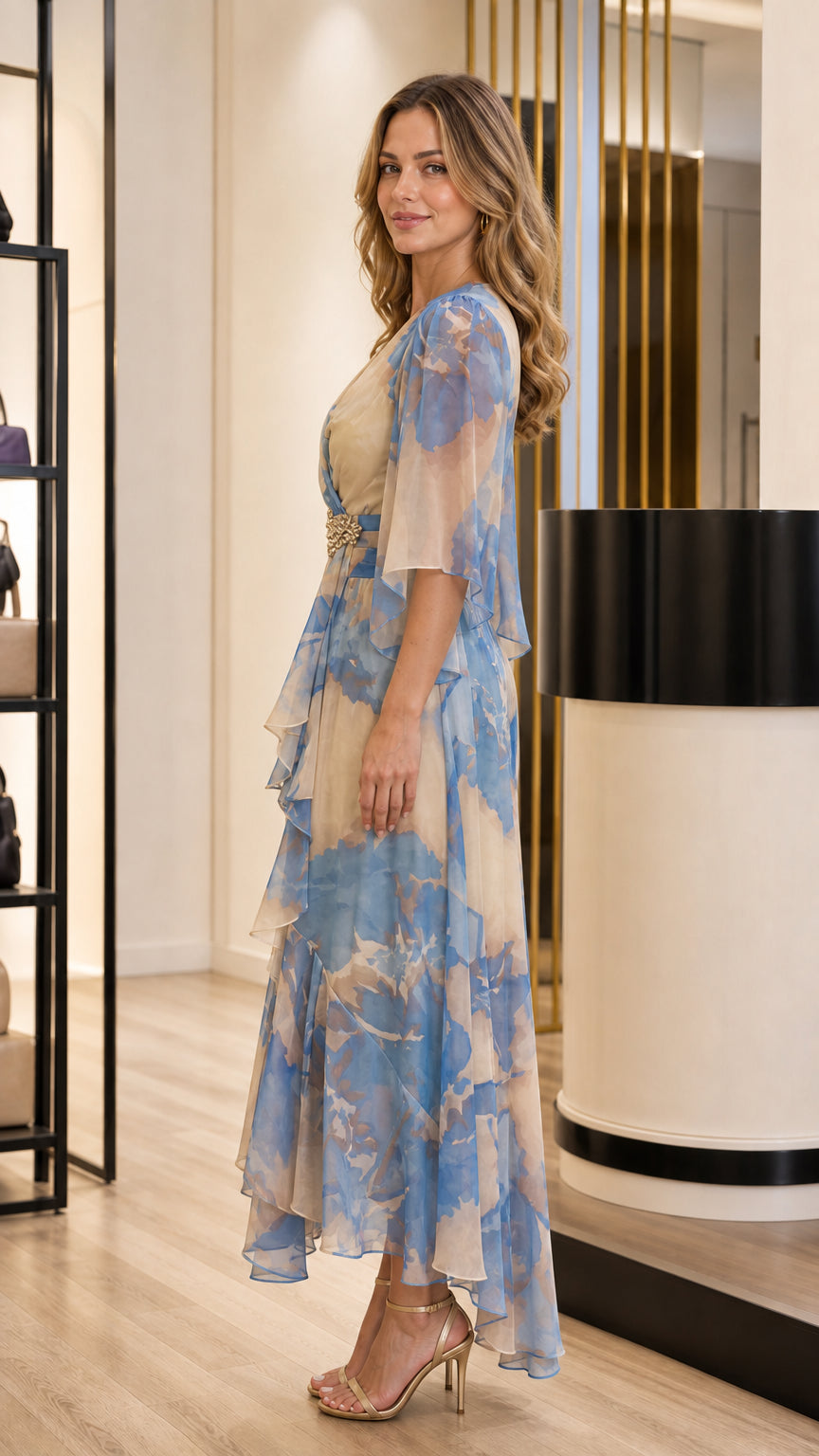 Side profile view of Beige Blue floral chiffon maxi gown showing tiered ruffles and flowing drape
