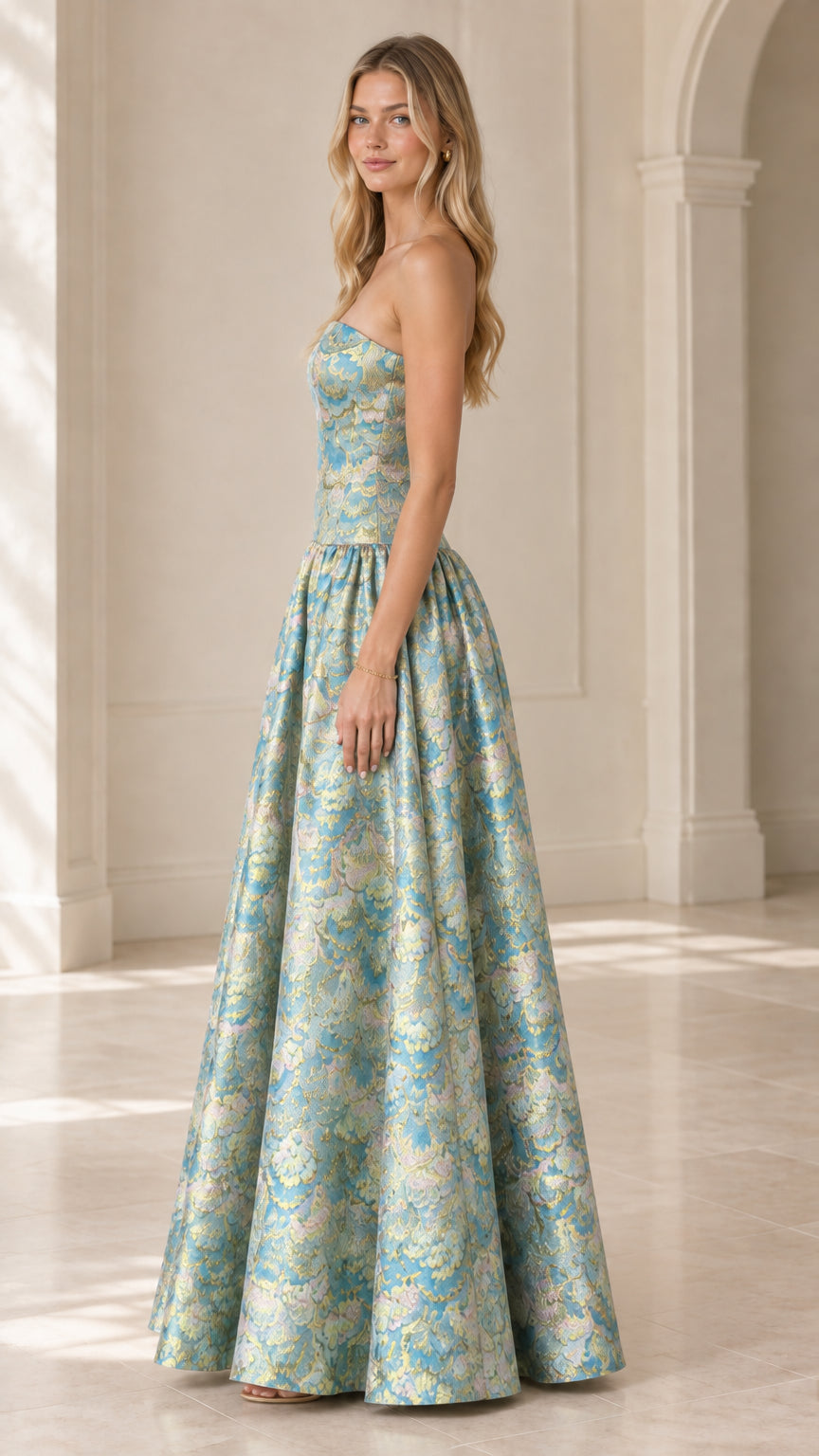 Side angle view of strapless aqua blue metallic jacquard formal evening dress