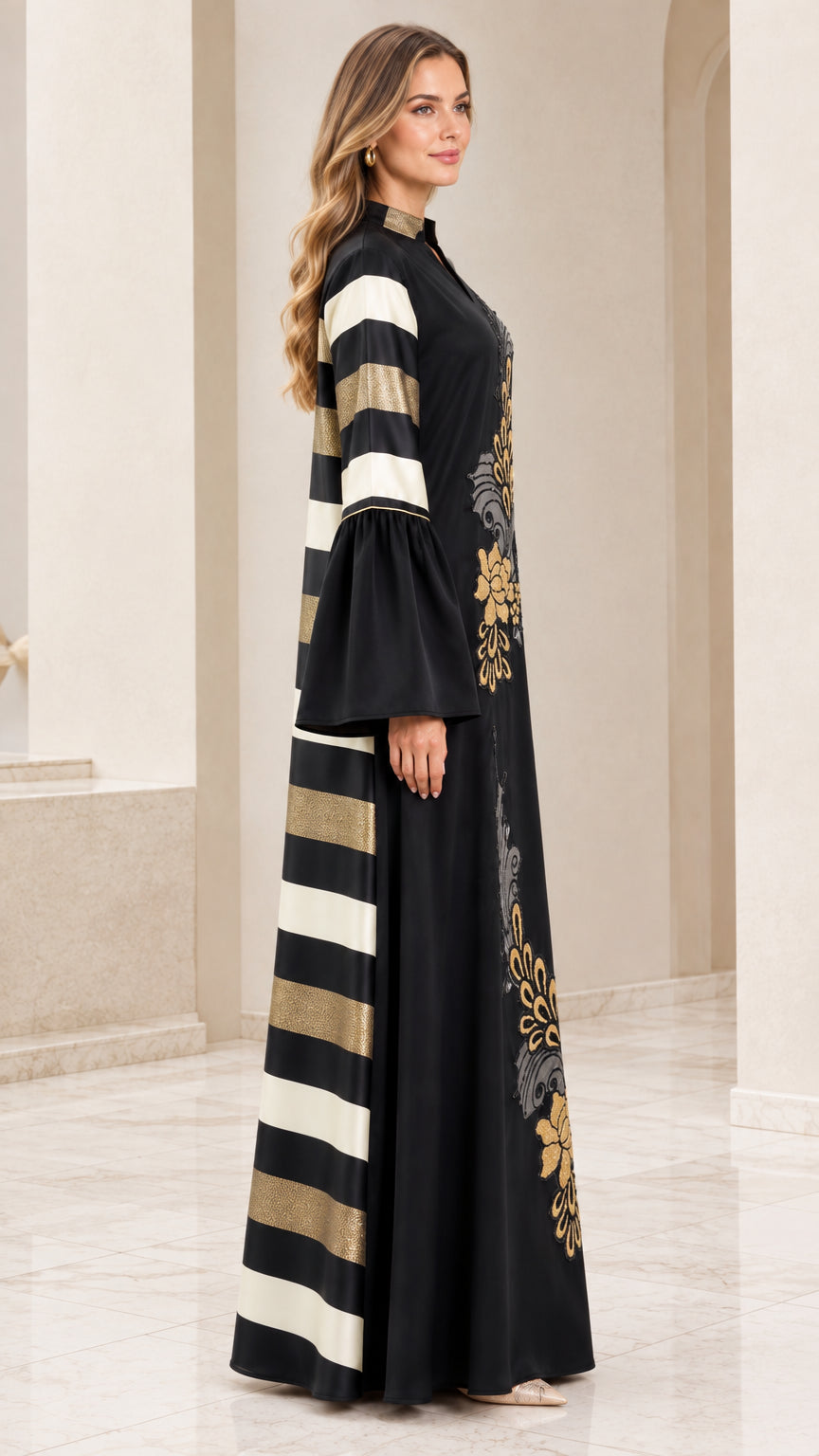 Side profile view of black modest maxi gown showing striped sleeve and side panel accents