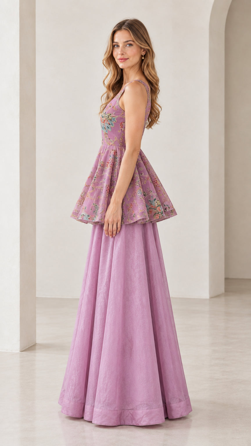 Side-angle view of model in lilac sleeveless embroidered peplum co-ord set