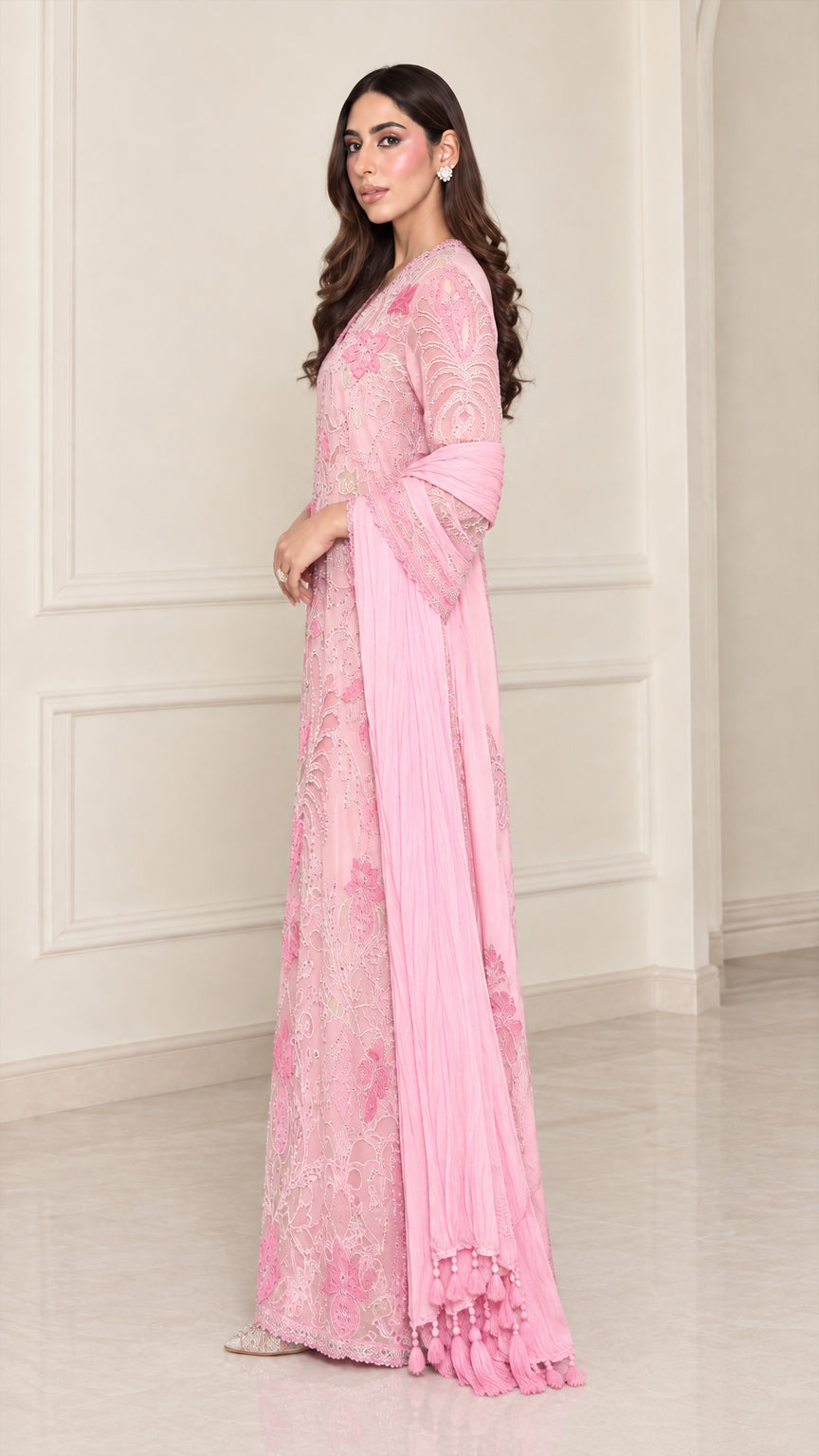 Side angle view of light pink embroidered formal evening gown
