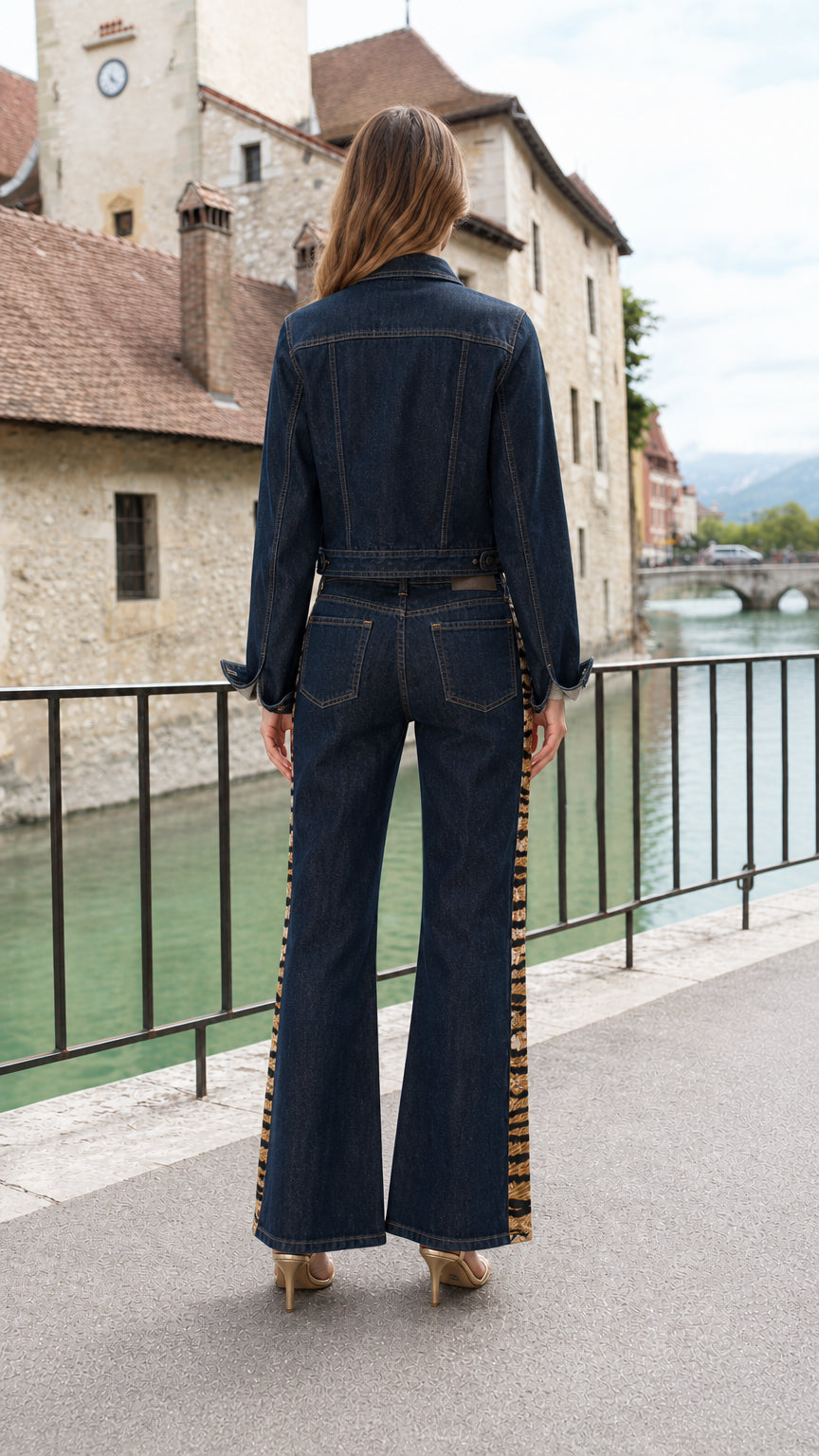 Back view of model wearing Dark Blue denim two piece jacket and flare pants set