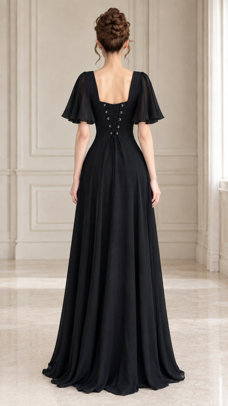 Back view of black maxi dress showing lace-up corset detail