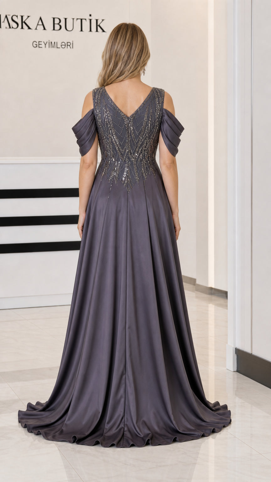 Back view of Charcoal Grey cold-shoulder gown showing deep V-back and satin train