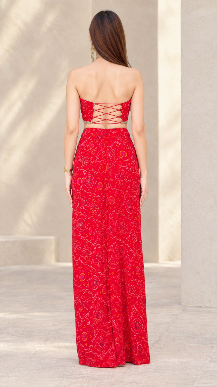 Back view of Red strapless crop top showing criss-cross lace-up tie details