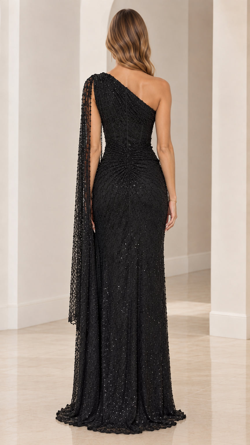 Back view of black sequin one-shoulder formal gown with floor-length hem