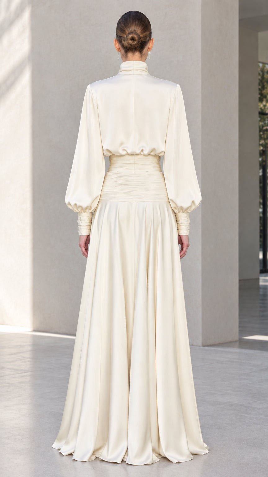 Back view of ivory satin cropped blouse and floor-length maxi skirt