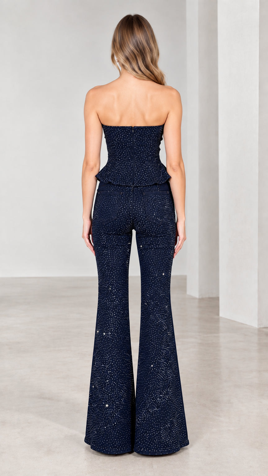 Back view of model in Navy Blue strapless rhinestone top and flared pants