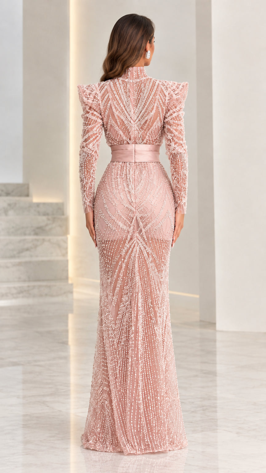 Back view of dusty pink beaded floor-length formal gown with structured shoulders