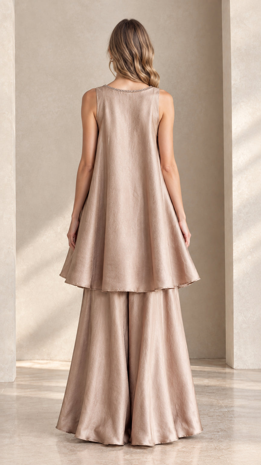 Back view of champagne two-piece tunic and palazzo trouser ensemble