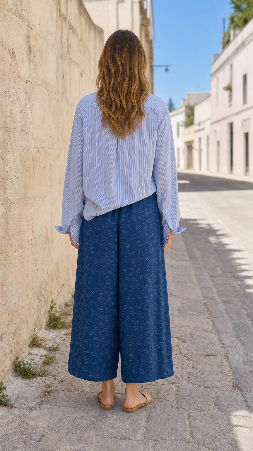 Back view of woman in blue two-piece set