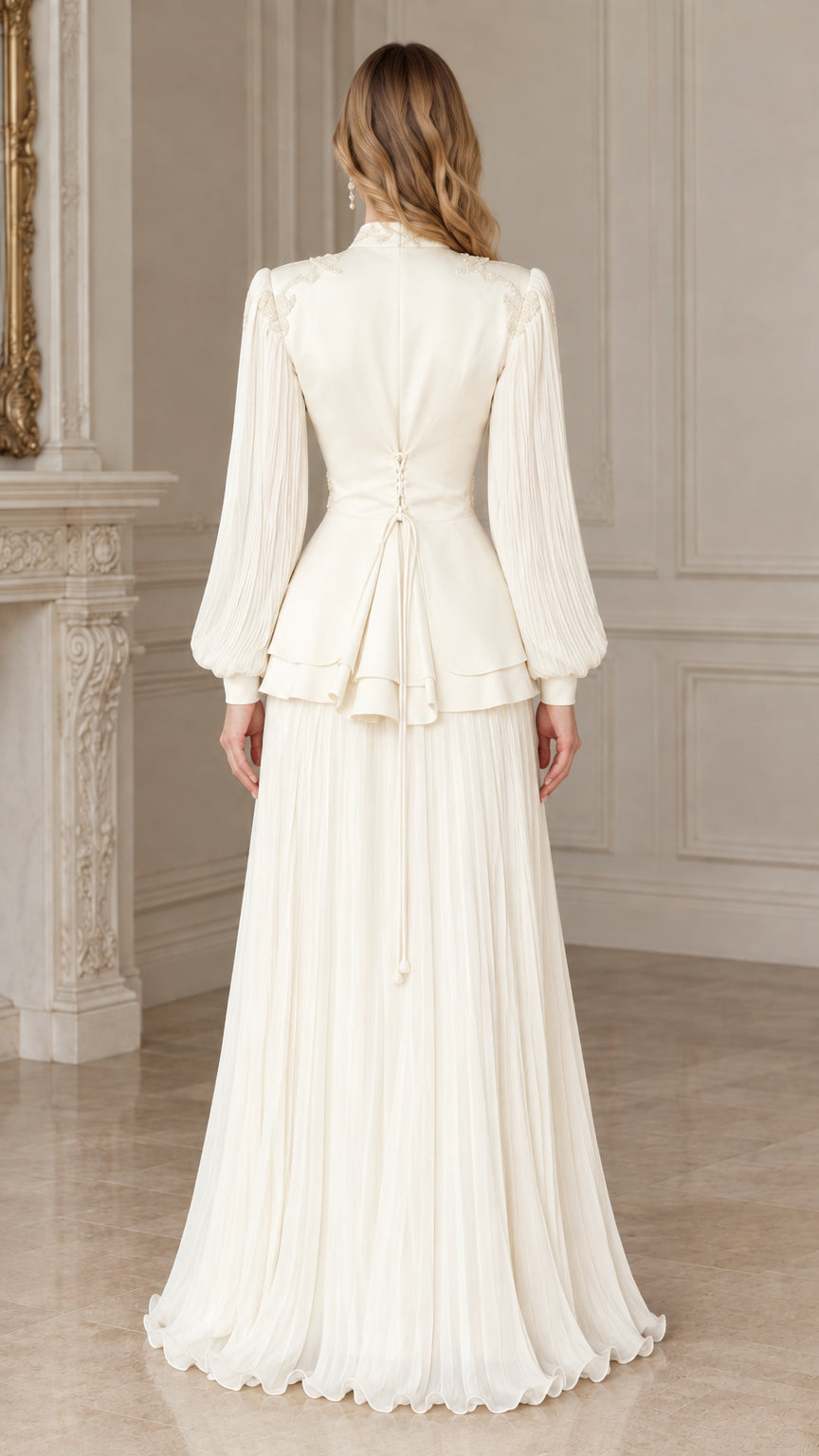 Back view of woman wearing ivory pleated evening gown with peplum jacket