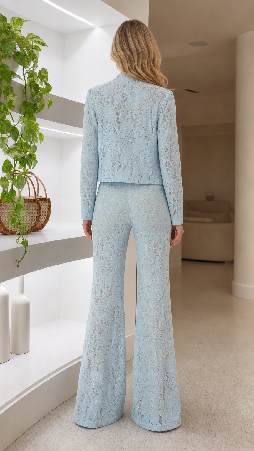 Back view of tailored light blue lace jacket and high waist flare pants