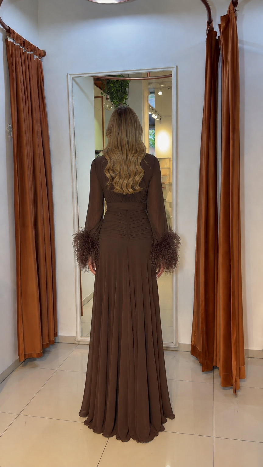 Back view of model wearing brown floor-length chiffon evening dress