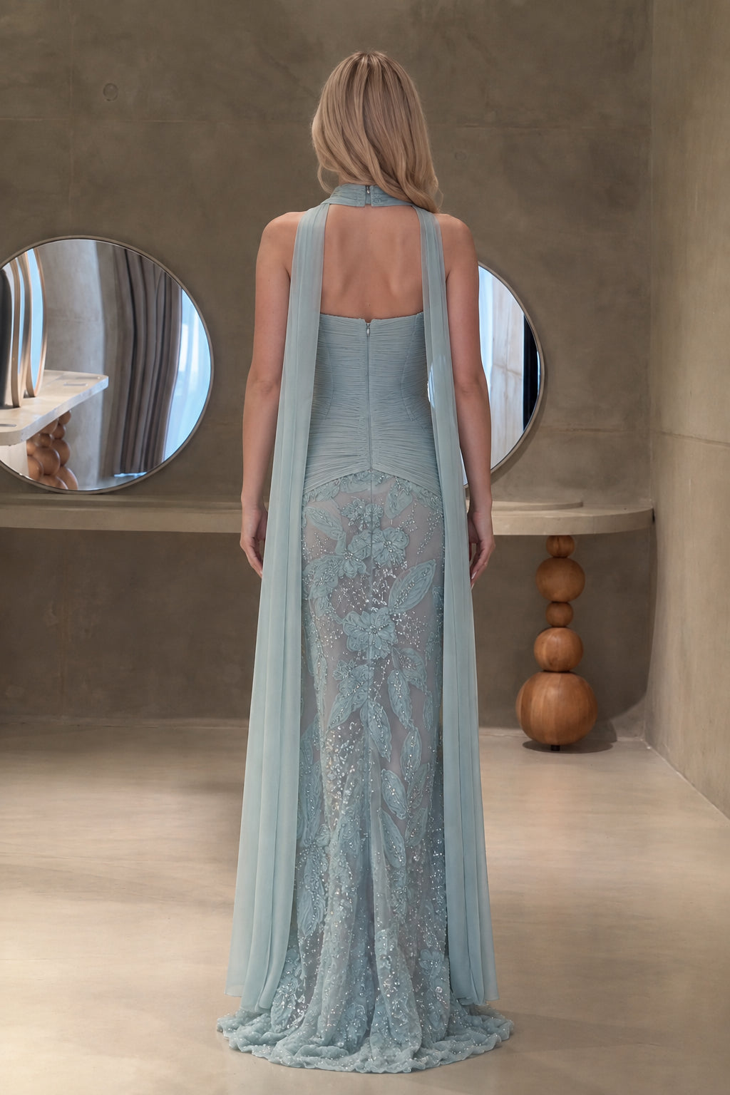 Dusty blue formal gown with flowing rear chiffon cape - back view
