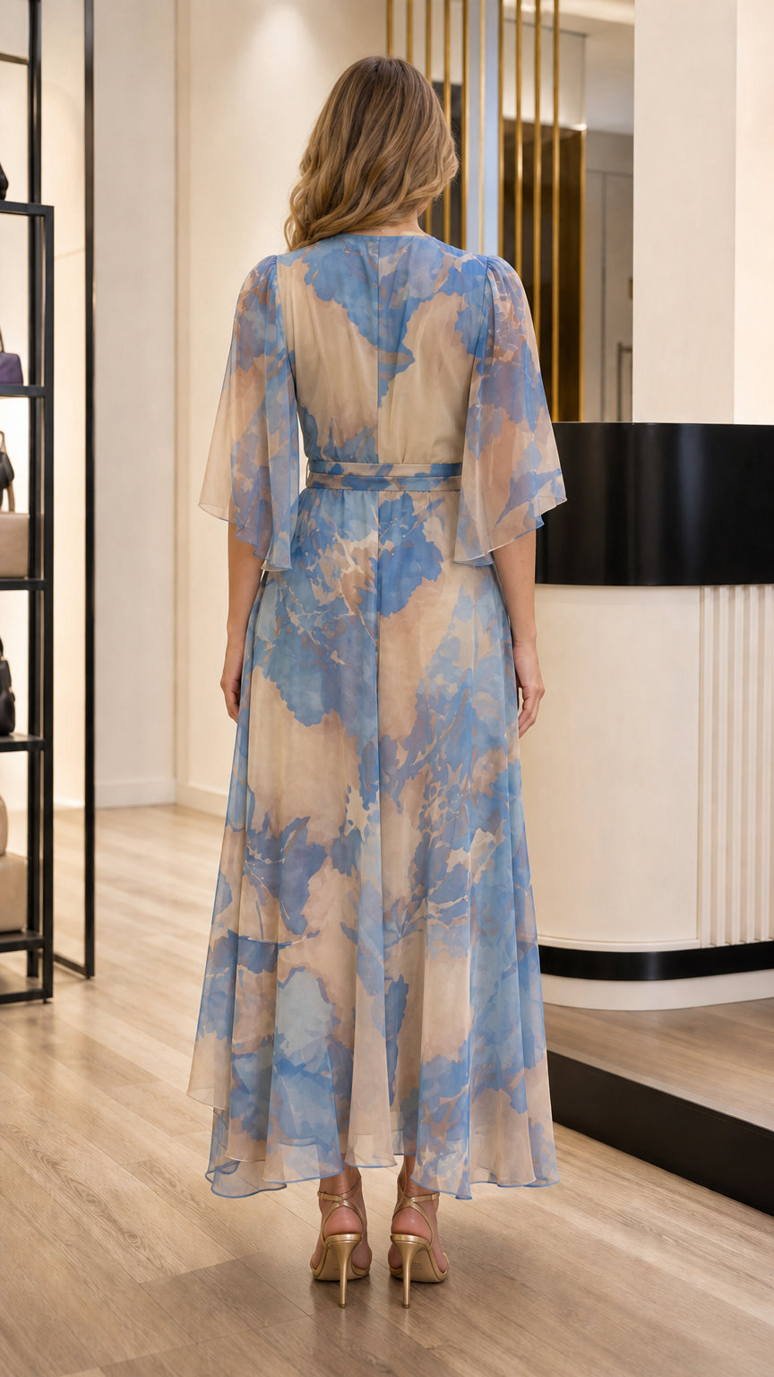 Back view of model wearing Beige Blue floral print chiffon dress with elbow sleeves