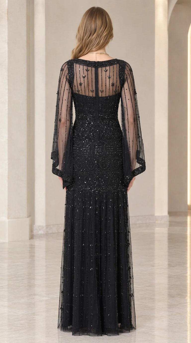 Back view of black evening gown highlighting sheer illusion back and zipper closure