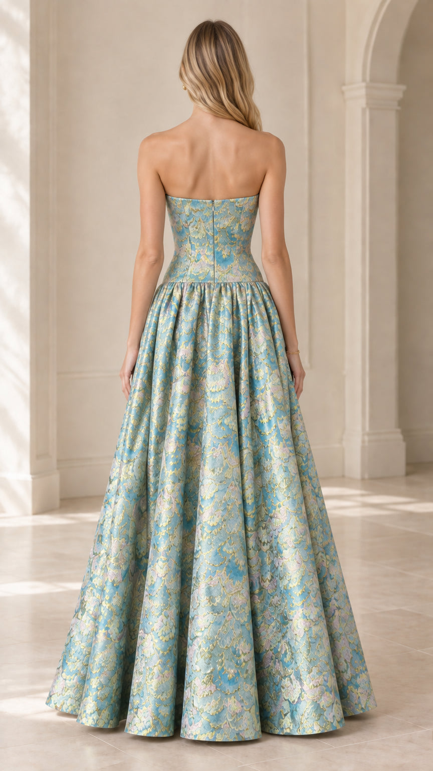Back view of strapless aqua blue brocade ball gown showing fitted bodice and zipper