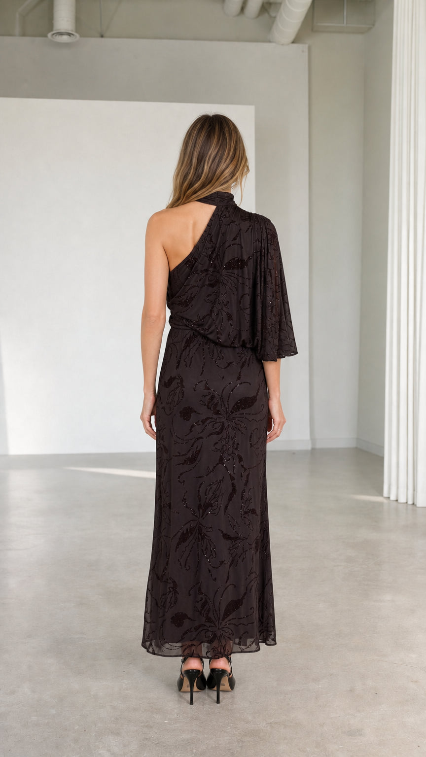 Back view of espresso brown one-shoulder high neck maxi gown