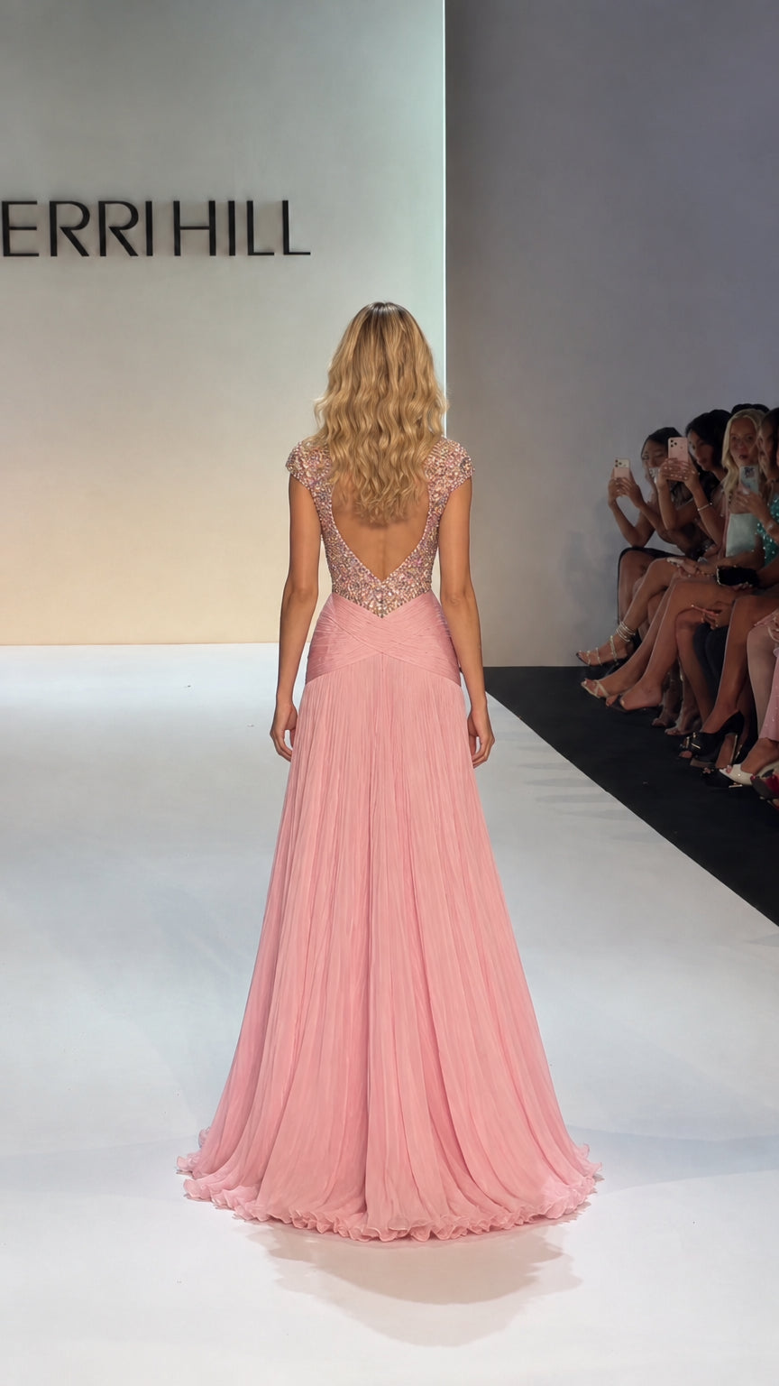 Back view of model showing open scoop back and flowing Blush Pink chiffon train