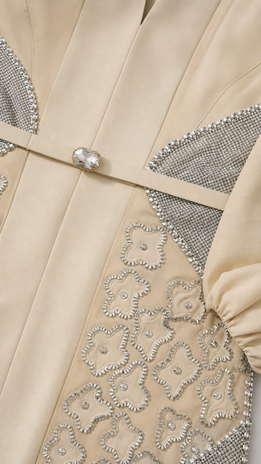 Close-up of rhinestone buckle and floral beadwork on Champagne gown