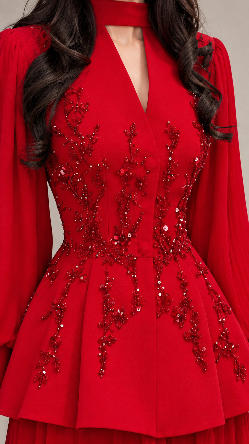 Close-up detail of red bodice featuring intricate sequin and bead floral embroidery