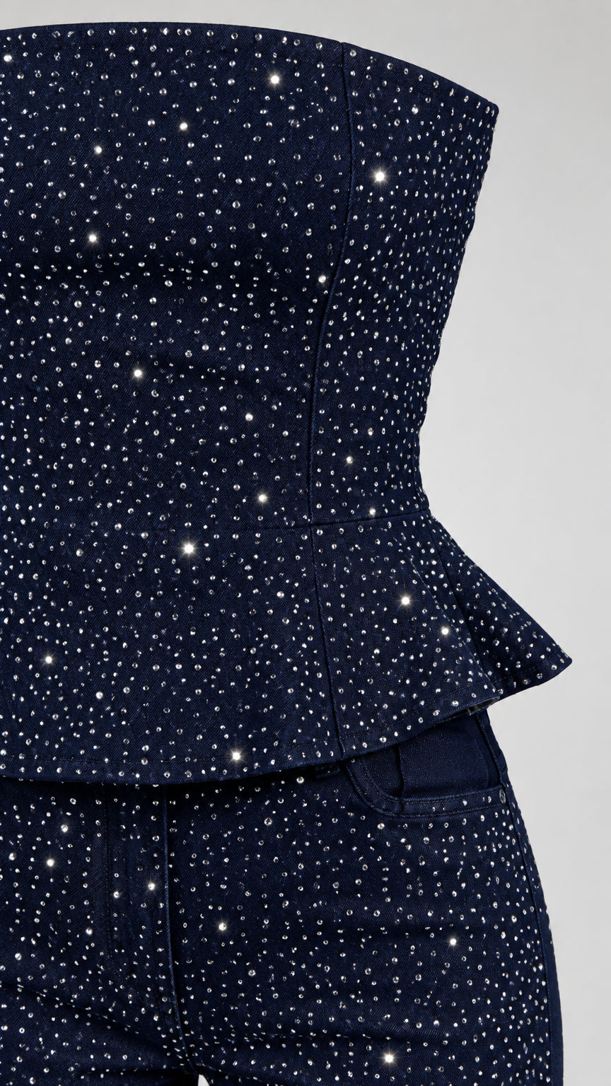 Close-up detail of rhinestone embellishments and peplum hem on Navy Blue top and pants