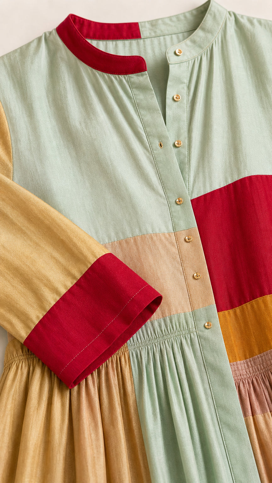 Close-up detail of the mandarin collar, buttons, and fabric texture