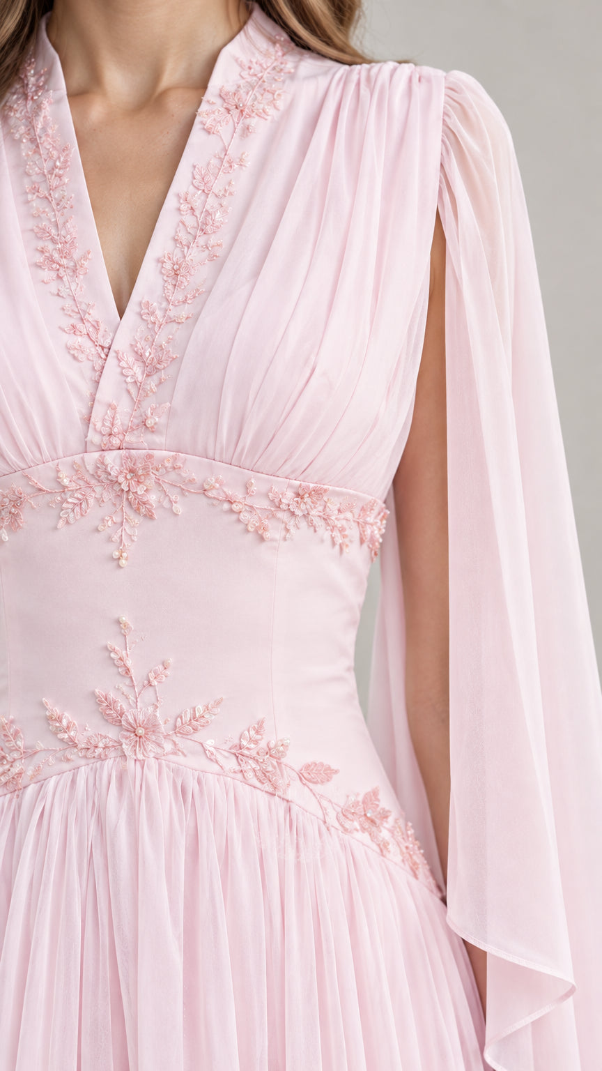 Close-up detail of bodice embroidery and V-neckline on Light Pink formal gown