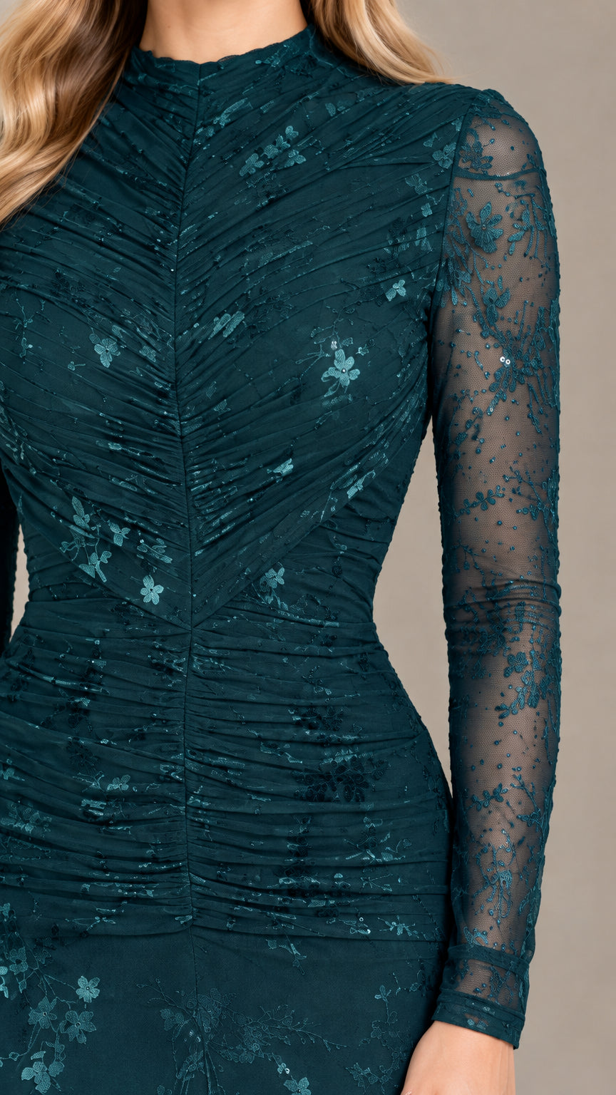 Close-up of ruched bodice and sheer floral lace sleeves on dark teal evening gown