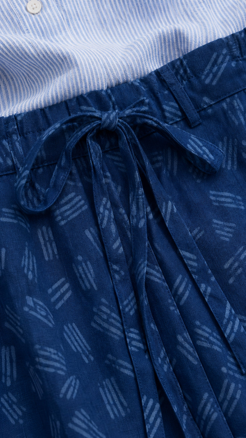 Close-up of the adjustable drawstring waistband and abstract pant print