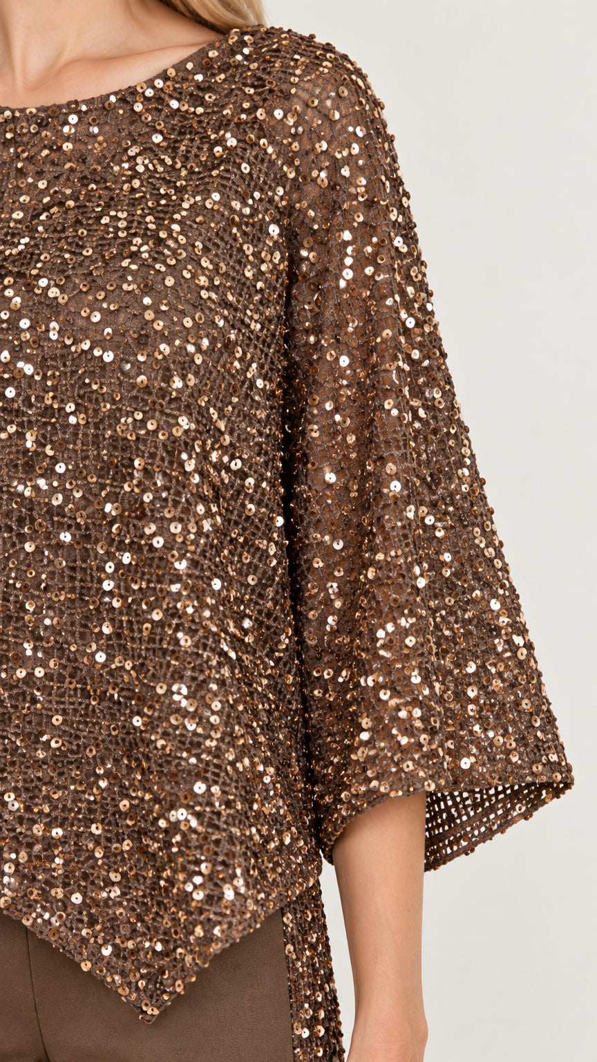 Close up view of mocha brown sequined mesh fabric and poncho sleeve detail